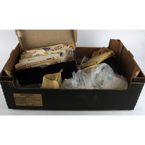 59 - Box with stamps in envelopes loose and a quantity of commercial mail in a box. Interesting lot.