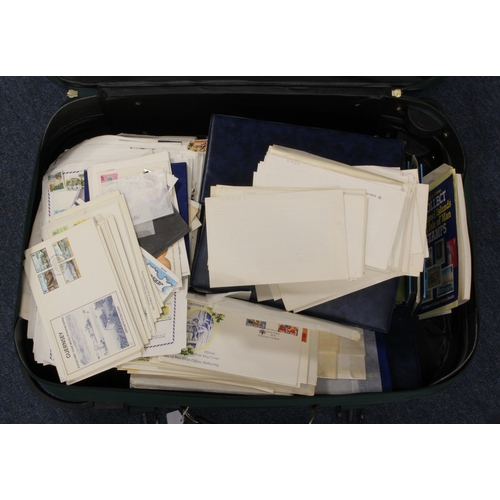 94 - Giant green suitcase packed with Jersey, Guernsey and I.O.M. stamps & FDC's. Favourable FV in UM set... 