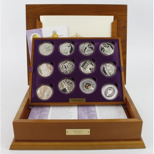 1097 - Queen Elizabeth II Golden Jubilee Collection. The 24 coin set of Silver Crown sized coins from aroun... 