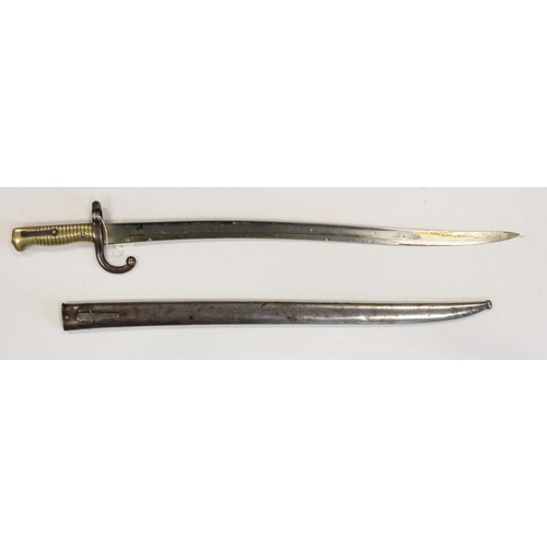 10 - Bayonet French model sabre bayonet signed on the back edge and dated 1872.  In its scarce German mod... 