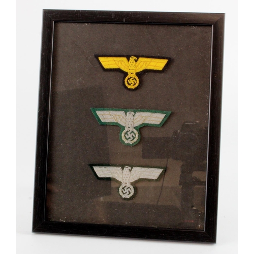 1050 - German set of three dress breast eagles in frame.