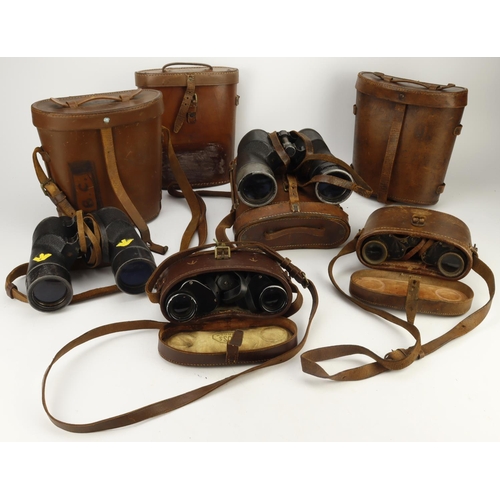 174 - Binoculars five pairs of WW2 British examples all in their leather cases.