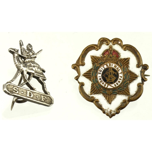 386 - Sweetheart badges cimprising an unmarked silver Defence Force badge and a brass and enamel Army Serv... 