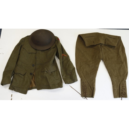 392 - US WW1 brodie helmet with WW1 US soldiers service jacket and britches.