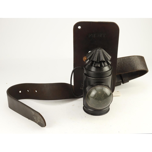 411 - WW1 1917 dated police lamp with its leather belt scarce unusual item.