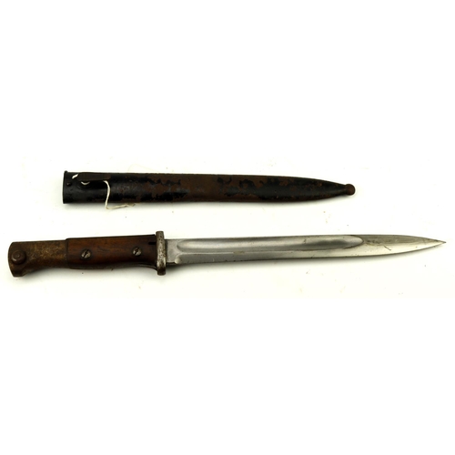 43 - German k98 wooden grip bayonet in its black painted scabbard.