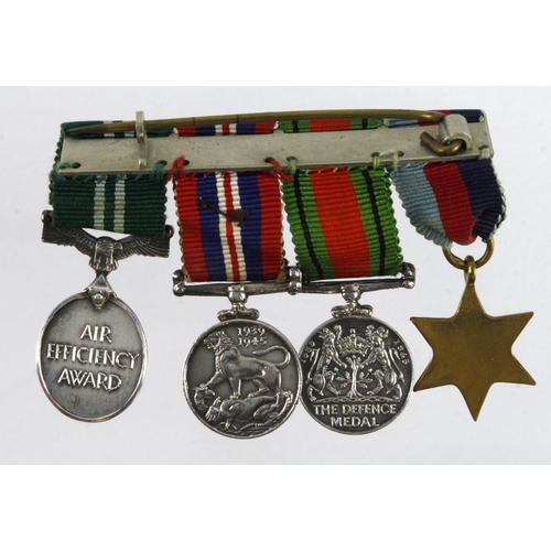 807 - Miniature medal group mounted as worn - 1939-45 Star, Defence & War Medals, GVI Air Efficiency Medal