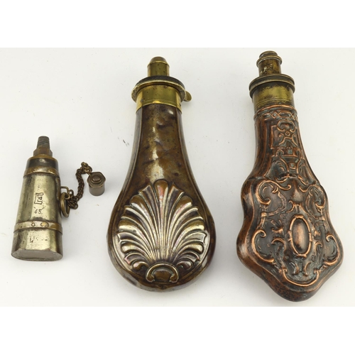 89 - Powder flasks, group of three copper and brass, being 1) circa 1870s, embossed with shell design bot... 