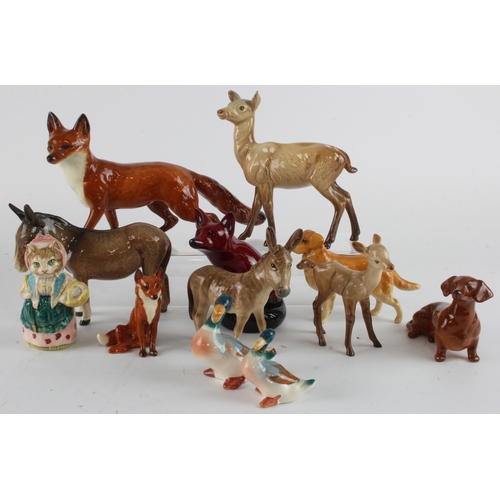 267 - Beswick. A collection of twelve various Beswick animal figures, including foxes, deer, donkeys, dogs... 