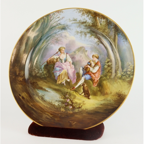 274 - Charger. A large unsigned charger, depicting a man & woman in a forest in front of a cottage, circa ... 