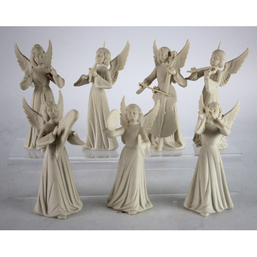 284 - Dresden. Seven Dresden porcelain angels, each playing an instrument, height