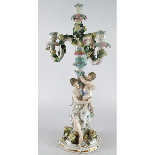 291 - German porcelain candelabra (possibly by Dresden), with three branches, ornately decorated depicting... 