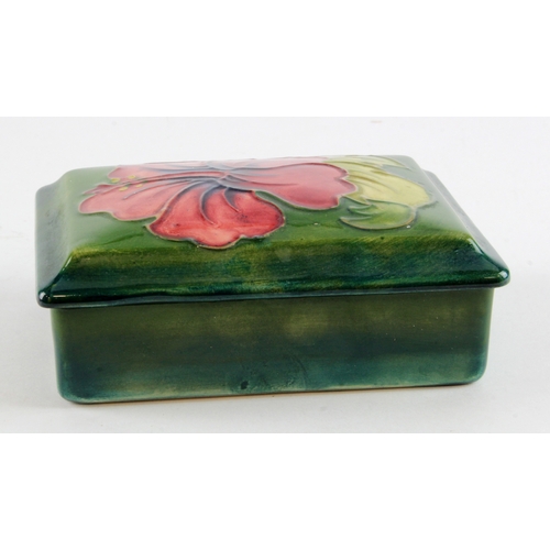 313 - Moorcroft Hibiscus pattern trinket box with lid, makers marks to base, diameter 15cm approx.