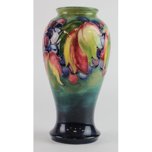 315 - Moorcroft leaf and berry pattern vase, makers marks and signed to base, height 22cm approx.