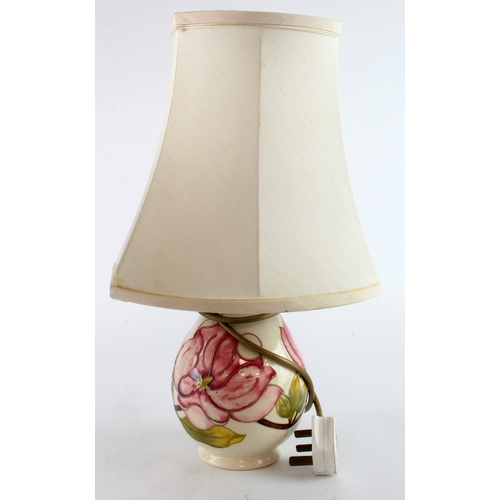 316 - Moorcroft Magnolia pattern table lamp, with shade, makers mark to base, total height 41.5cm approx.