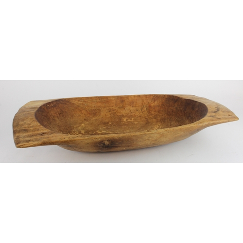 445 - Aboriginal interest. A large Aboriginal wooden bowl, height 10.5cm, length 64cm, width 31cm approx.