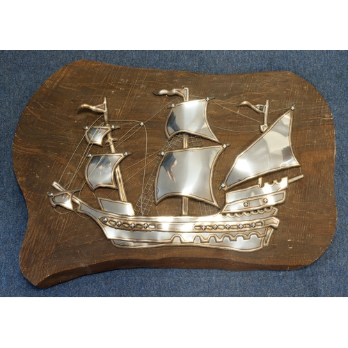 487 - Large metal arts & crafts three masted ship, mounted on a wooden plank, total size 88cm x 64cm appro... 