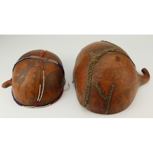 523 - Tribal interest. Two half shell vessels, both with carved decoration, circa late 19th to early 20th ... 