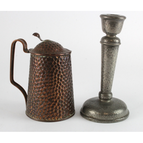 524 - Tudric pewter candlestick and a similar copper jug with lid, the base of this jug is marked 