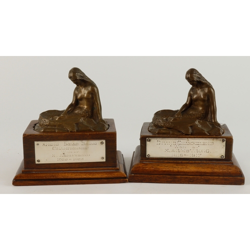 525 - Two bronze mermaids for the Mermaid Swimming Club with unmarked silver plaques on two wooden bases. ... 