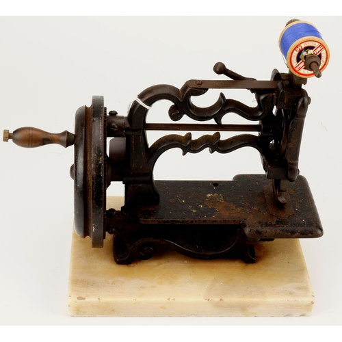 528 - Victorian sewing machine made by James Weirs, mounted on a marble base, total height 22.5cm, length ... 