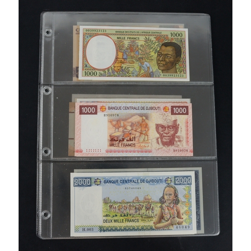 418 - Africa (13), a high grade group in album sleeves, Central African States 1000 Francs, Djibouti 1000 ... 