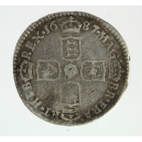 196 - Sixpence 1687 late shields, S.3413, VF, light graffiti.