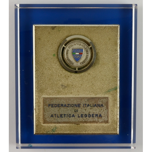 929 - Italy, Olympic-related white metal plaque 90mm on clear plastic mount: FEDERAZIONE ITALIANA DI ATLET... 