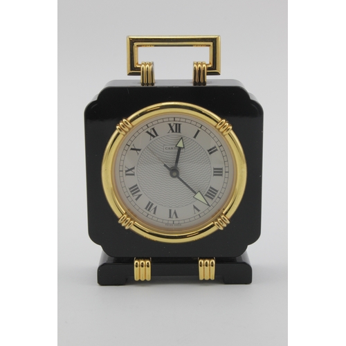 328 - Cartier Art Deco style 'Oynx' desk clock. The white dial with Roman numerals, quartz movement, seria... 