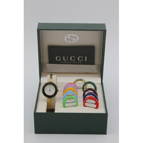 119 - Ladies gold plated Gucci quartz wristwatch, ref.11/12.2. Complete with box and interchangable bezels... 