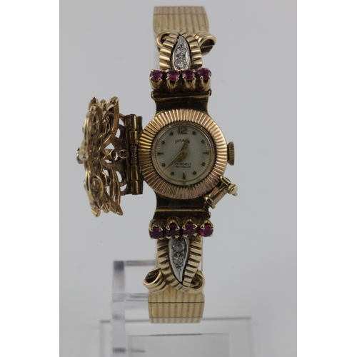 151 - Josarn 9ct yellow gold ruby and diamond set ladies bracelet watch, circa 1960. The concealed dial si... 