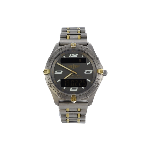 204 - Breitling Aerospace titanium and gold gents quartz wristwatch, ref. F65362, purchased 2001. The grey... 