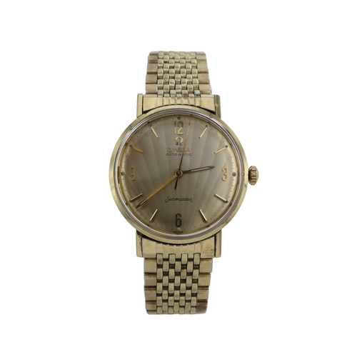 52 - Omega Seamaster 14k gents automatic wristwatch, ref. L-6590, circa 1960. The gilt 'clamshell' dial w... 