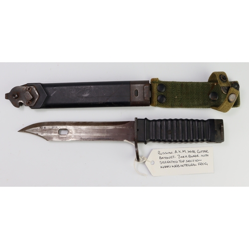 107 - Russian A.K.M. wire cutter Bayonet & scabbrd, 7 inch blade, with serated top section, khaki web inte... 