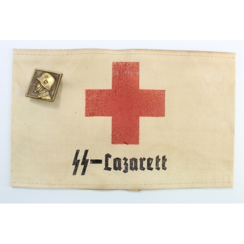 1079 - German SS Lazarett armband dated 1944 and SS Lapel badge.