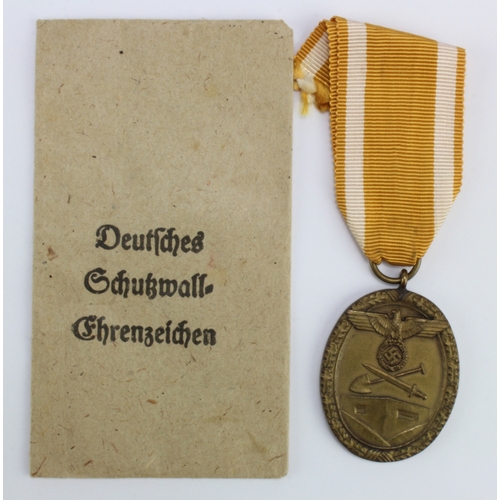 1121 - German West Wall medal in packet of issue.