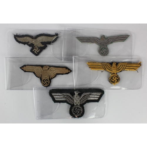 1149 - German WW2 collection of five breast eagles all different some moth damage.