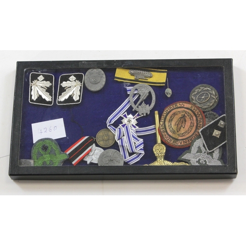 1151 - German WW2 collection of various medals badges etc in display case.