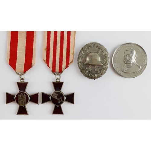 1194 - Imperial German silver wounds badge, two City tribute medals and a medallion.