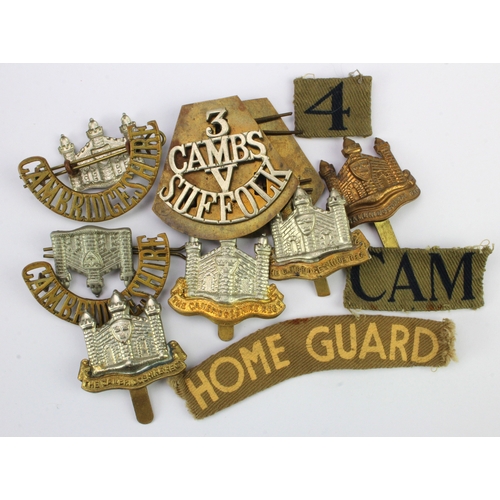 215 - Cambridge Regt various WW1 & WW2 cap badges, shoulder titles, etc incl a pair of 3/CAMBS/V/SUFFOLK t... 