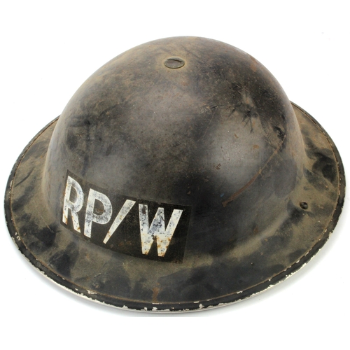 472 - WW2 Home Front Helmet with liner and chinstrap, marked up 'RP/W'. Rim stamped inside 'F37'.   (Repai... 