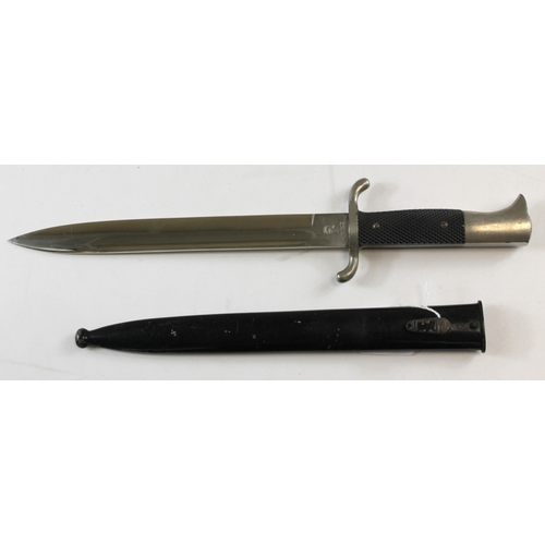 64 - German WW2 Fireman’s dress dagger blade maker marked WKC in its black painted scabbard.