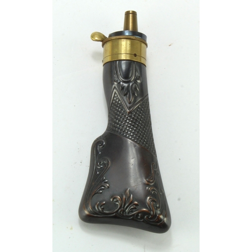 98 - Powder flask in the shape of a rifle butt, good quality reproduction, embossed design on both sides,... 