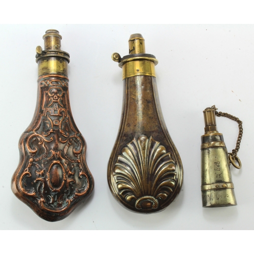 99 - Powder flasks, group of three copper and brass, being 1) circa 1870s, embossed with shell design bot... 