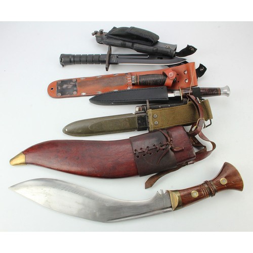 85 - M9 Bayonet, M7 Bayonet, Kukri dated 1917, 2x fighting knives, and a folding knife.  (Sold as seen)