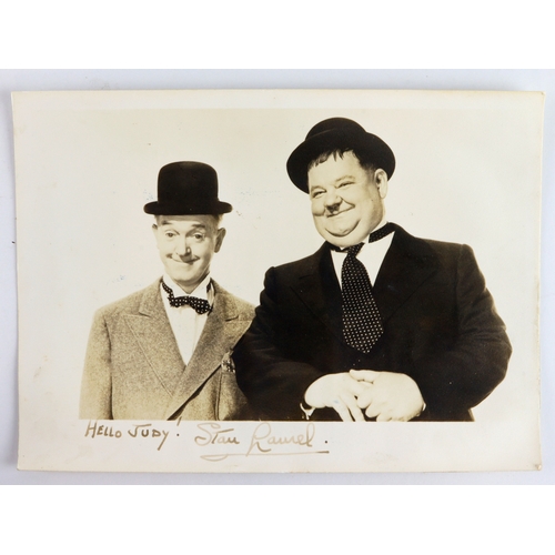 18 - Laurel (Stan). An original black & white card depicting Laurel & Hardy, signed to base in ink 'Hello... 