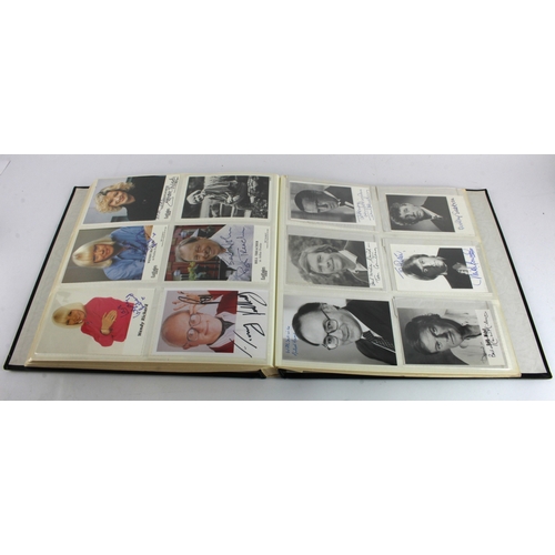 8 - Autographs. A large album containing approximately 280 signed photographs of mostly television perso... 