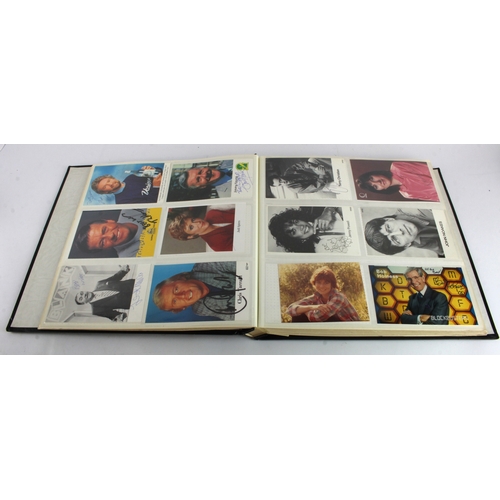 8 - Autographs. A large album containing approximately 280 signed photographs of mostly television perso... 