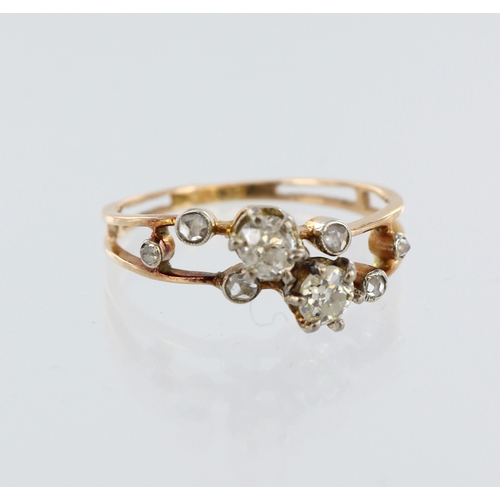 132 - Yellow gold (tests 18ct) diamond multi stone ring, two principal round old cuts, six further round r... 