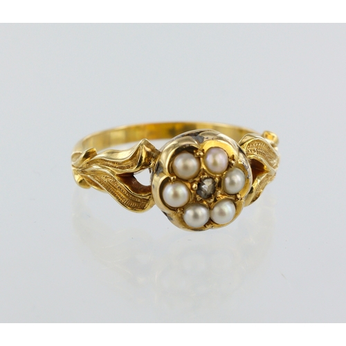 137 - Yellow metal pearl and diamond cluster ring, six seed pearls in closed back setting, single round mi... 